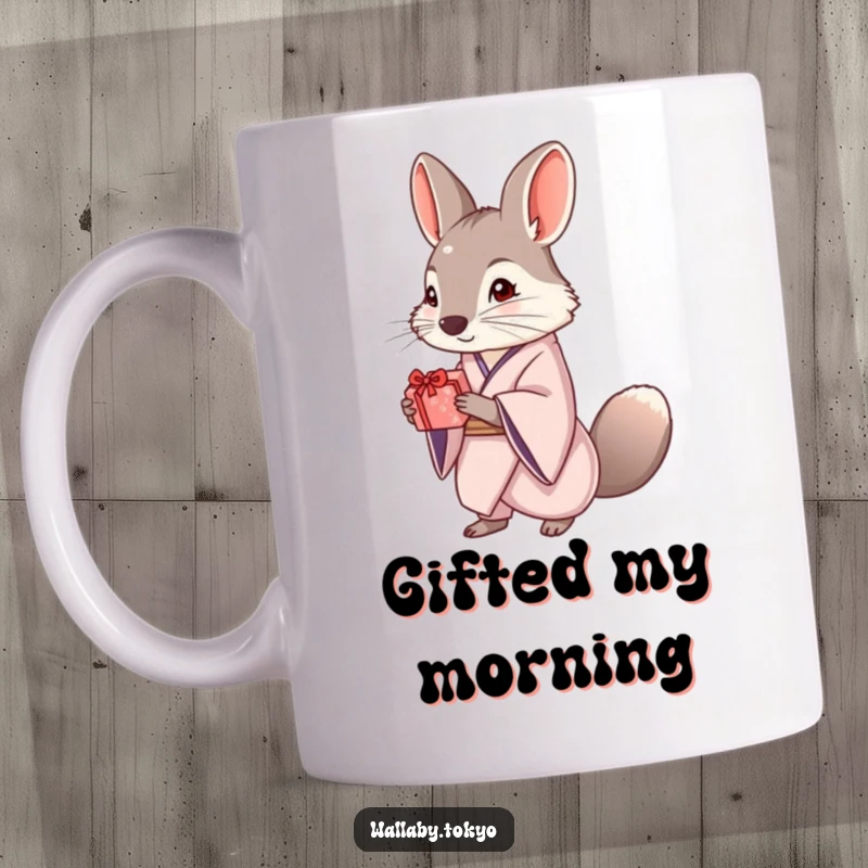 Funny mug featuring an elegant wallaby dressed in a kimono, politely offering a small, beautifully wrapped gift with a gentle smile.